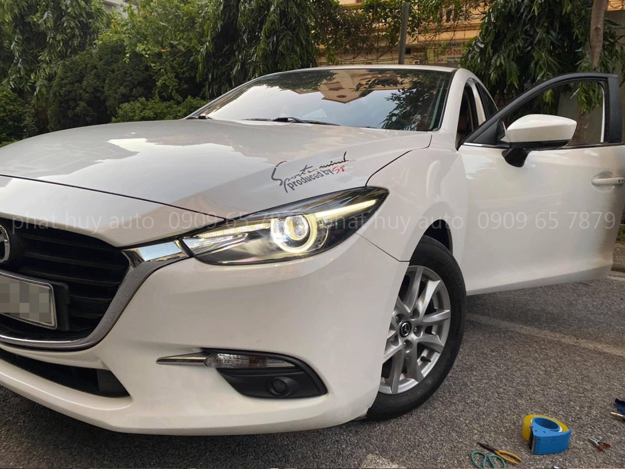 Thay đèn pha cho Mazda 3